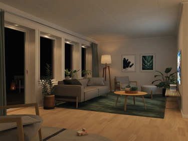 Kveldsbilde av stue og spotlights i vindu - husmodellen Edith