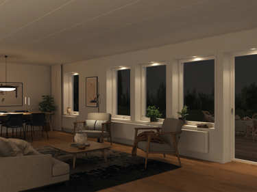 Kveldsbilde av stue med LED spotlights i vinduskarm og dørkarm i husmodellen Edvard