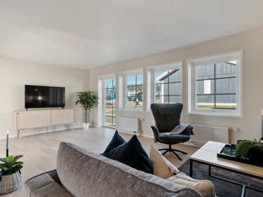 Bilde av stue med sprosser på vinduene - husmodellen Astrid