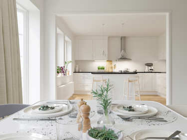 Bilde av spisestue og kjøkken med kjøkkenøy i huset Fanny