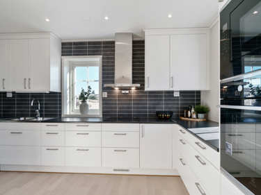 Bilde av kjøkkenbenk og hvitevarer i huset Greta