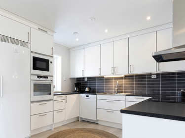 Bilde av kjøkkenbenk og hvitevarer fra Electrolux - husmodellen Sofia